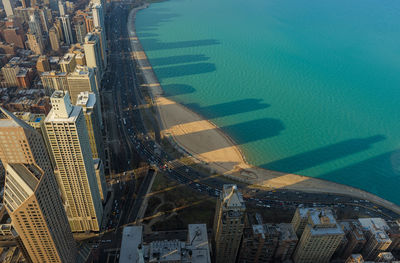 Aerial view of cityscape by sea