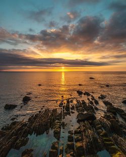 Scenic view of sea against sky during sunset