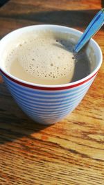 Directly above shot of coffee on wooden table
