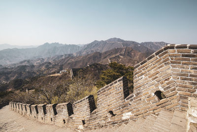 View of built structures against mountain range