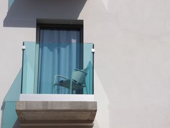 Blue window on wall of building