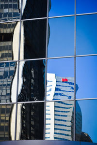 Low angle view of modern building against clear blue sky