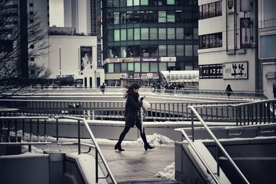 Woman standing in city