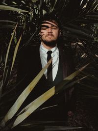 Portrait of young man looking at camera