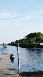 Pier over lake against sky