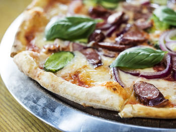 Close-up of pizza in plate on table