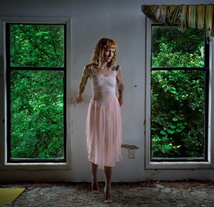 Beautiful woman standing in the dark