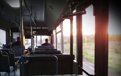 Rear view of people sitting in bus