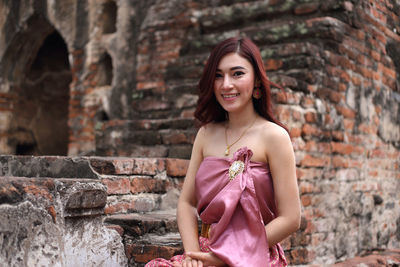 Portrait of smiling young woman outdoors