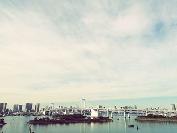 Commercial dock by sea against sky