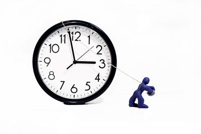 Close-up of clock against white background