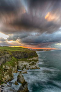 Scenic view of sea against sky at sunset