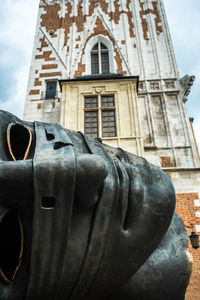 Low angle view of statue against building