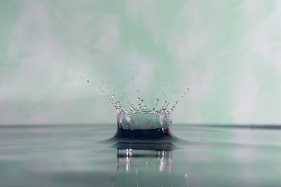 Close-up of water splashing against black background