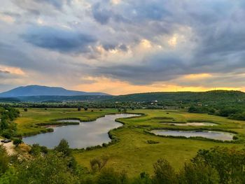 Scenic view of landscape against sky during sunset