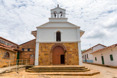 Low angle view of bell tower against sky