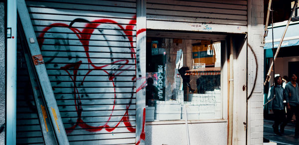 People on street by building