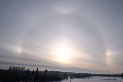 Scenic view of snow against sky during sunset