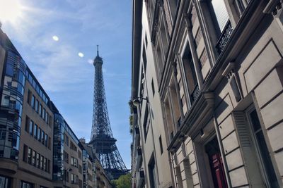 Low angle view of paris landmarks against sky