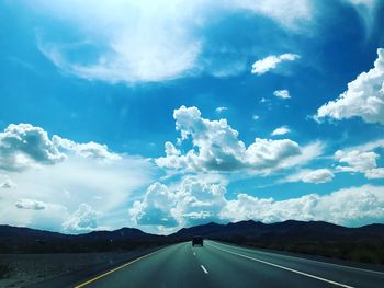 View of road against cloudy sky