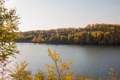 Scenic view of lake against clear sky during autumn