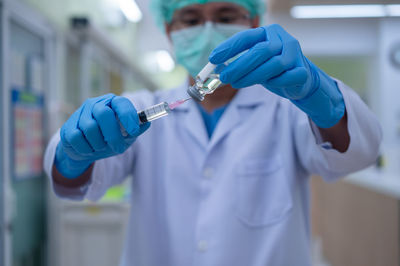 Midsection of person working