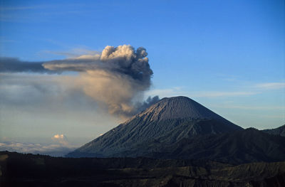 Huge eruption at mount bromo with enormous ash cloud at beaty clear morning