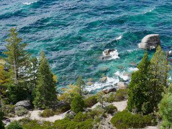 High angle view of sea by rocks