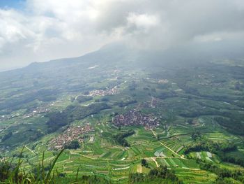 Aerial view of agricultural landscape against sky