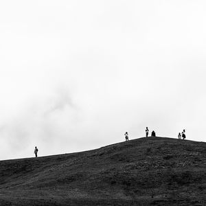 Silhouette of people on landscape