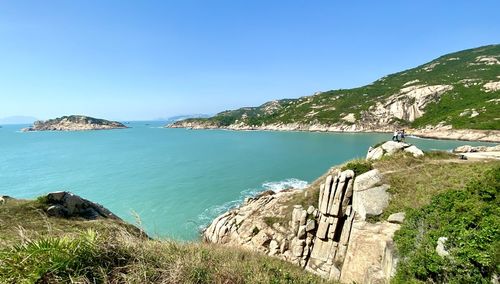 Scenic view of sea against clear blue sky