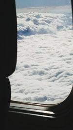 Close-up of snow covered landscape against sky