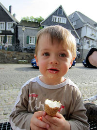 Portrait of cute boy holding ice cream