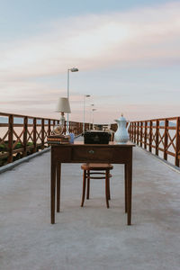 Old desk. work table on a pier. working with a beautiful landscape.  nomad life.