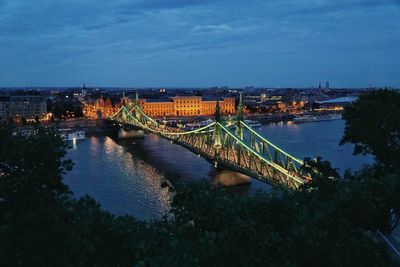 High angle view of illuminated bridge over river against sky