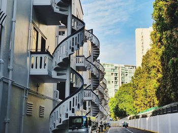 Street amidst buildings in city against sky