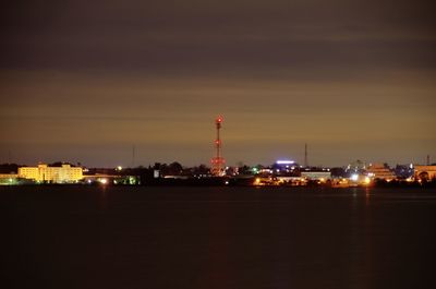 Illuminated city buildings at night