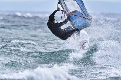 Man splashing water in sea