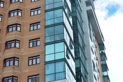 Low angle view of modern buildings against sky