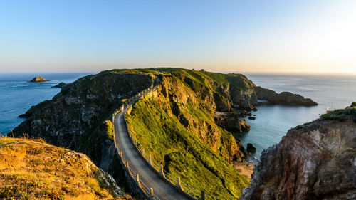 Scenic view of sea against clear sky during sunset