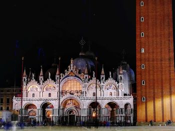 Illuminated cathedral against sky at night