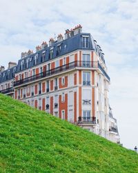 Residential buildings against sky in city