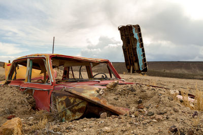 Abandoned building in field