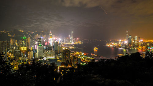 High angle view of illuminated city buildings at night