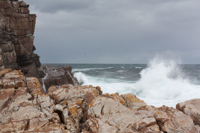 Waves splashing on rocks at shore