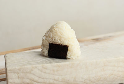 One mini onigiri with seaweed belt, japanese rice ball