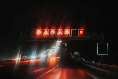 Light trails on road in city at night