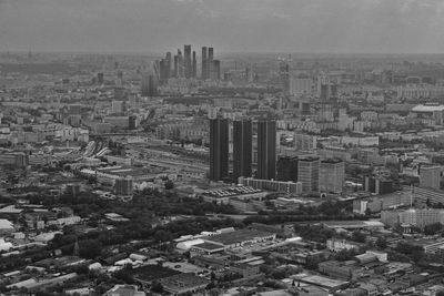 High angle view of buildings in city against sky