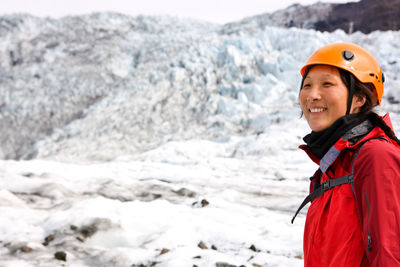 Woman hiking up sólheimajökull glacier in south iceland