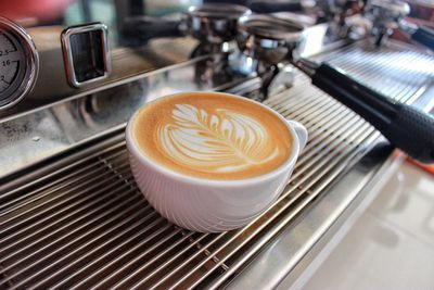 Close-up of cappuccino on table